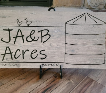 Wooden farm sign for JA&B Acres