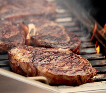 Wiggins Ranch ribeye steaks on grill