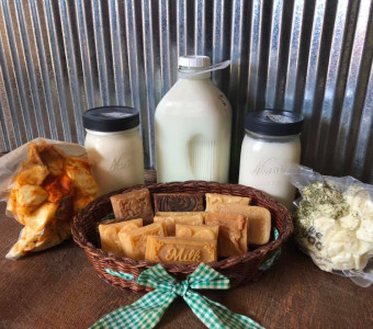 Different products we offer: milk, cream, cheese, and soap.