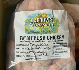 A picture of one of our whole packaged chickens with our label on the front.