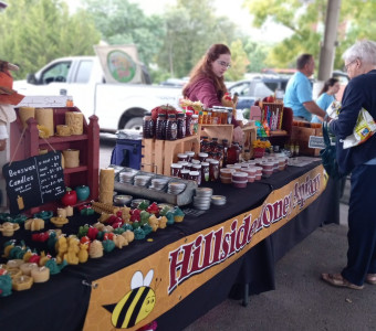 Local Leavenworth bee farm located in Easton, Kansas sells raw honey, beeswax candles and cut flowers at the Leavenworth Farmers market