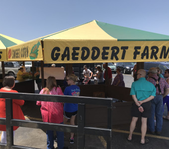 Gaeddert Farms Sweet Corn stand with line of people