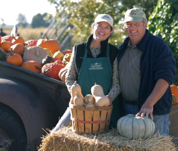 John and Karen with squash and pumpkins